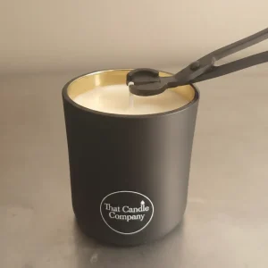 That Candle Company Professional Wick Trimming Tool being used on a candle That Candle Company Professional Wick Trimming Tool being used on a candle