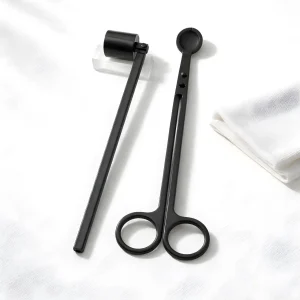 Luxury Professional Candle Care Set featuring a matte black wick trimmer and snuffer inside a black velvet drawstring bag.