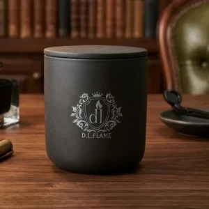 A luxury MIDNIGHT BLOOM candle styled on a dark wood mantle for a moody home aesthetic.