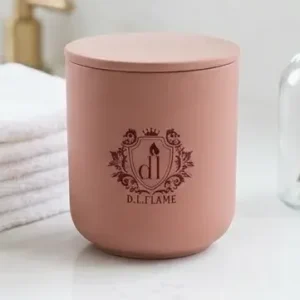 Close-up of a SPICED ROSE candle showing the elegant ceramic texture and pink lid.