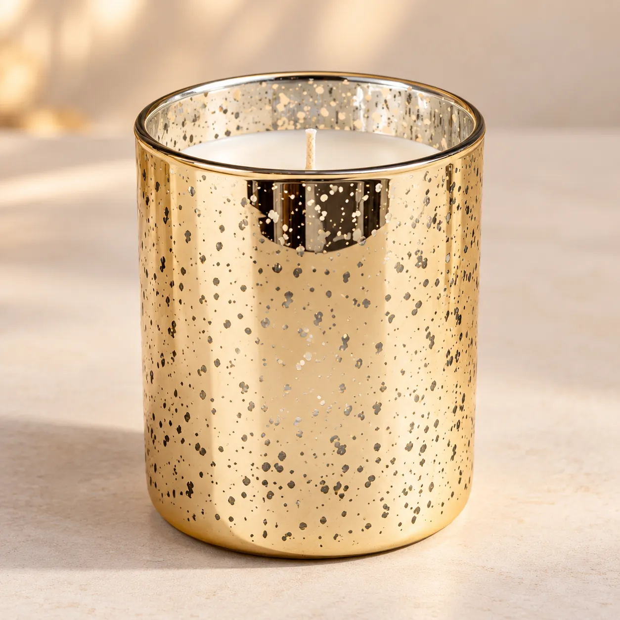 Golden Noël festive spiced candle with warm golden glow
