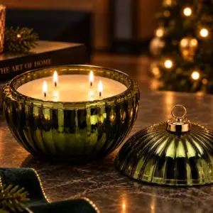 Emerald Solstice four wick green Christmas candle in large emerald bauble vessel