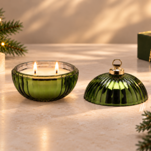 Emerald Solstice double wick Christmas candle in green bauble vessel