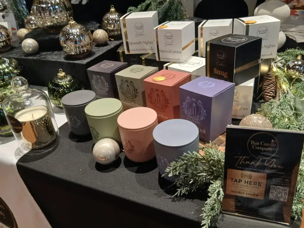 Handmade coconut soy scented candles in ceramic vessels and amber glass jars